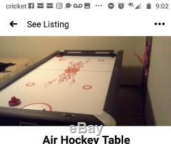 Briar Professional size air hockey table. Barely used, white, red, good buy