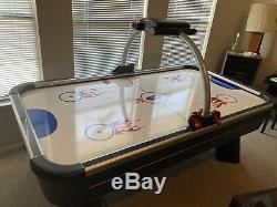 Full size air hockey table with electronic scoring and sound effects
